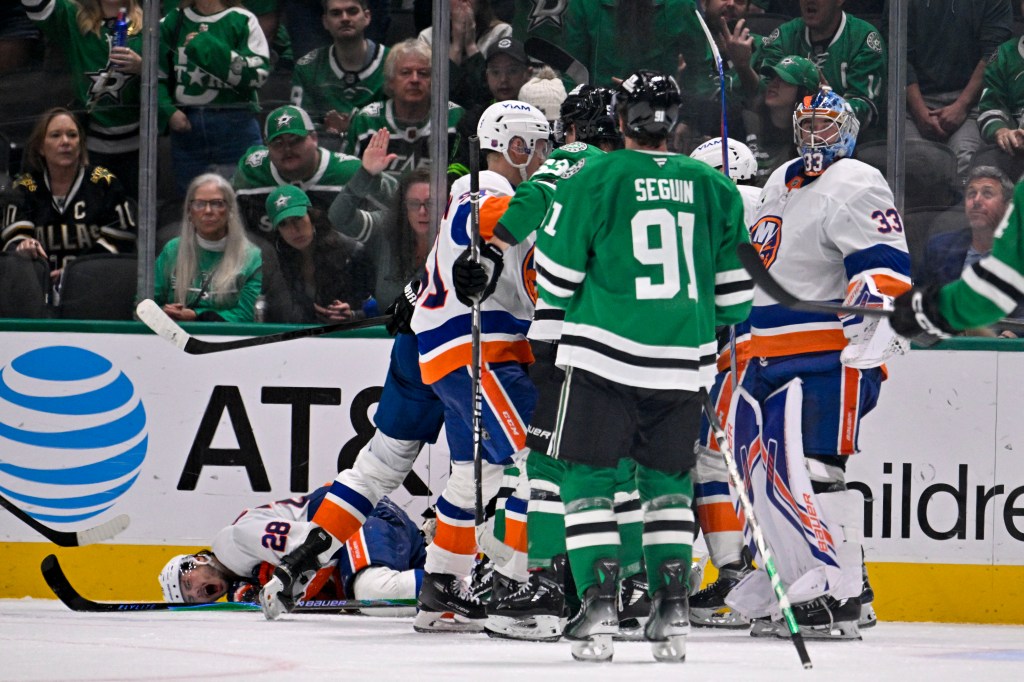 Dallas Stars right wing Mikko Rantanen (96) is called for a game misconduct penalty for boarding on New York Islanders defenseman Alexander Romanov (28) during the third period at the American Airlines Center.