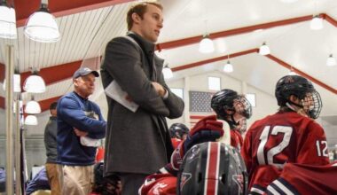 From left: John Gardner and Mark Naclerio behind the Avon Old Farms bench. (Evan Sayles/Avon Old Farms School)