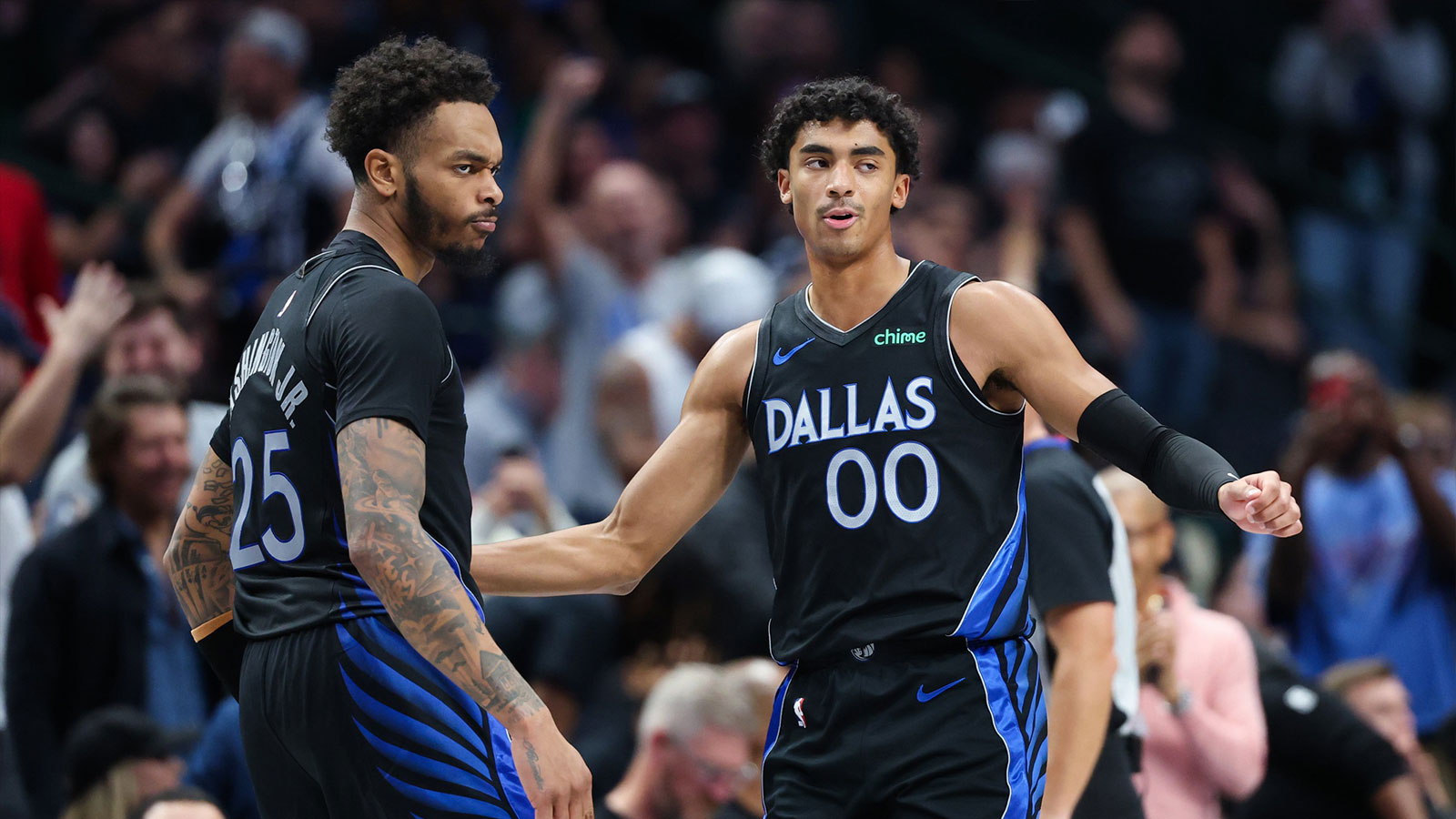 Mavericks guard Max Christie (00) celebrates with Dallas Mavericks forward P.J. Washington (25) after scoring during the second half against the Portland Trail Blazers at American Airlines Center