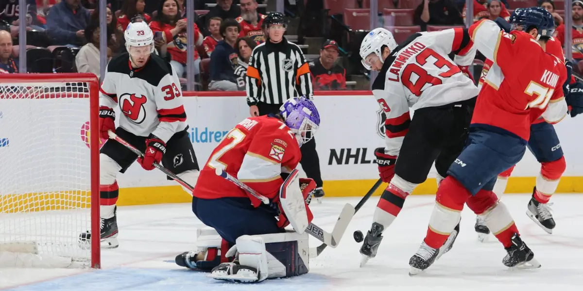 Sergei Bobrovsky makes a save against Juho Lammikko and the New Jersey Devils on Thursday night at Amerant Bank Arena.