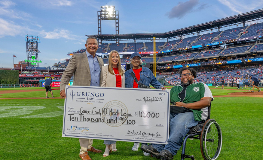 Ahead of the Phillies' Sept. 26, 2025, game against the Minnesota Twins, Grungo Law gave a $10,000 donation check to the Camden County New Jersey Miracle League.