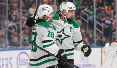 Jamie Benn (right) celebrates his 400th career goal with Sam Steel during the first period of Tuesday's win over the Oilers.