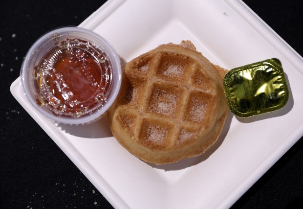 A mini waffle is served during the “Taste of the...