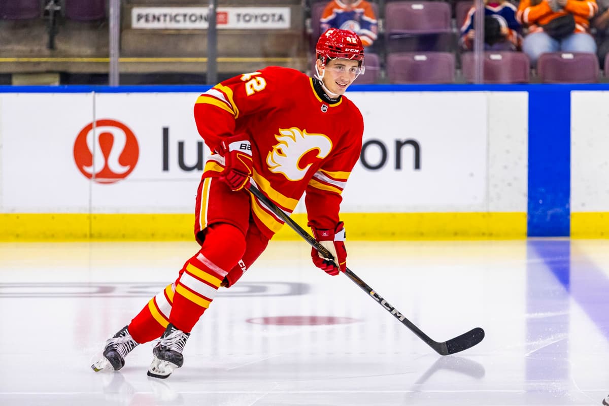 Flames rookie forward Sam Honzek leaves Saturday’s game after collision with Mikael Backlund