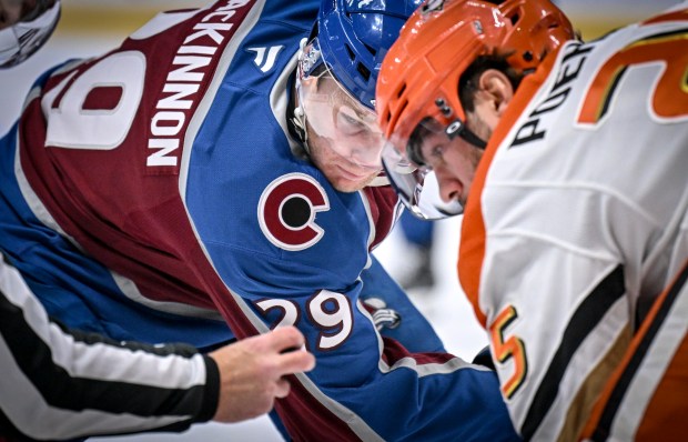 Nathan MacKinnon (29) of the Colorado Avalanche and Ryan Poehling (25) of the Anaheim Ducks prepare to face off during the third period at Ball Arena on Tuesday, Nov. 11, 2025. (Photo by AAron Ontiveroz/The Denver Post)