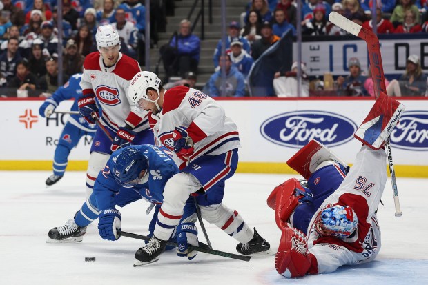 Gabriel Landeskog #92 of the Colorado Avalanche fights for the puck against Alexandre Carrier #45 of the Montreal Canadiens in the second period at Ball Arena on November 29, 2025 in Denver, Colorado. (Photo by Matthew Stockman/Getty Images)