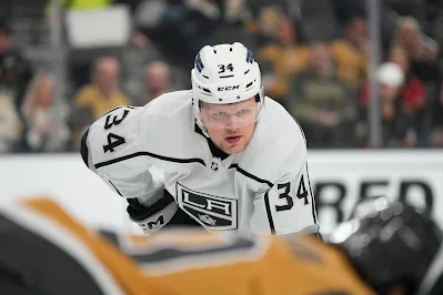 Los Angeles Kings forward Arthur Kaliyev lines up for faceoff during 2023 game. Los Angeles Kings forward Arthur Kaliyev lines up for faceoff during 2023 game.