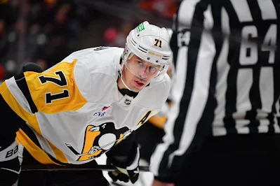 Pittsburgh Penguins forward Evgeni Malkin lines up for faceoff during 2025 game. Pittsburgh Penguins forward Evgeni Malkin lines up for faceoff during 2025 game.