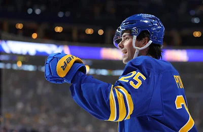 Buffalo Sabres defenseman Owen Power celebrates a goal during 2025 game.