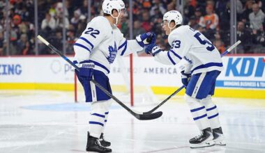 Nov 1, 2025; Philadelphia, Pennsylvania, USA; Toronto Maple Leafs defenseman Jake McCabe (22) celebrates a goal by right wing Easton Cowan (53) against the Philadelphia Flyers in the third period at Xfinity Mobile Arena.