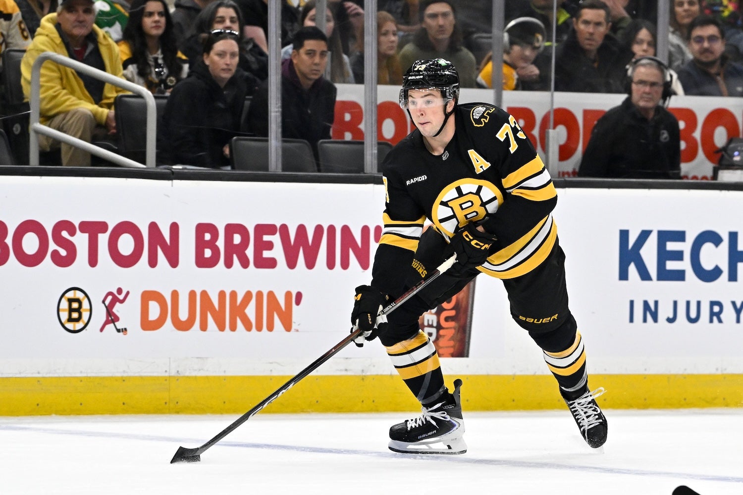 Nov 1, 2025; Boston, Massachusetts, USA; Boston Bruins defenseman Charlie McAvoy (73) with the puck during the first period against the Carolina Hurricanes at TD Garden. Mandatory Credit: Eric Canha-Imagn Images