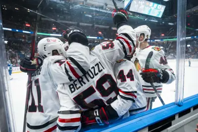 Nov 5, 2025; Vancouver, British Columbia, CAN; Chicago Blackhawks forward Oliver Moore (11) and forward Tyler Bertuzzi (59) and defenseman Wyatt Kaiser (44) celebrate Bertuzzi’s third goal of the period against the Vancouver Canucks in the third period at Rogers Arena. Mandatory Credit: Bob Frid-Imagn Images