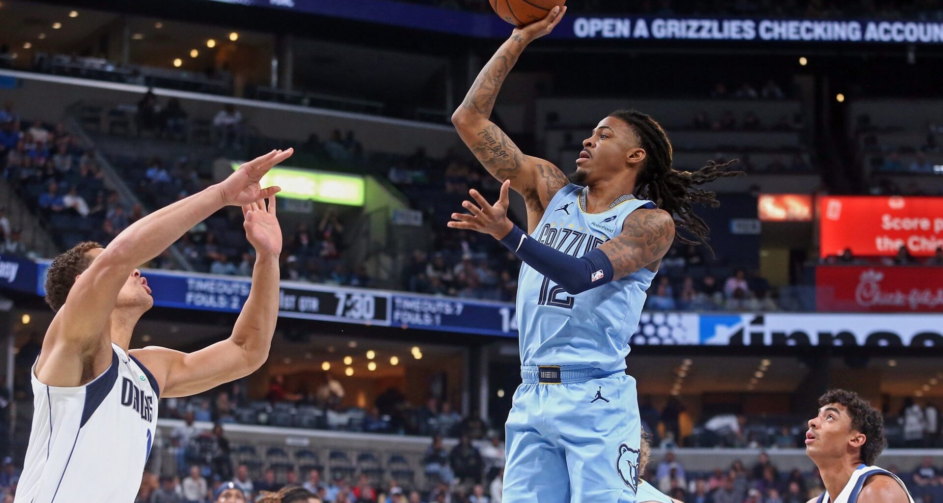 Nov 7, 2025; Memphis, Tennessee, USA; Memphis Grizzlies guard Ja Morant (12) shoots during the first quarter against the Dallas Mavericks at FedExForum. Mandatory Credit: Petre Thomas-Imagn Images