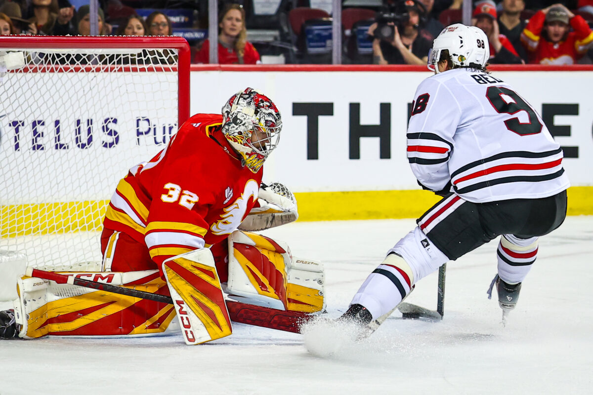 Bedard's Four Point Night Lifts Blackhawks Past Flames