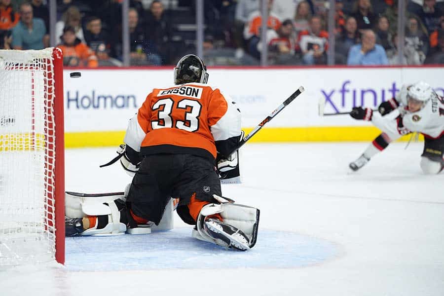 Nov 8, 2025; Philadelphia, Pennsylvania, USA; Philadelphia Flyers goalie Samuel Ersson (33) allows a goal against Ottawa Senators center Tim Stutzle (18) in the first period at Xfinity Mobile Arena.
