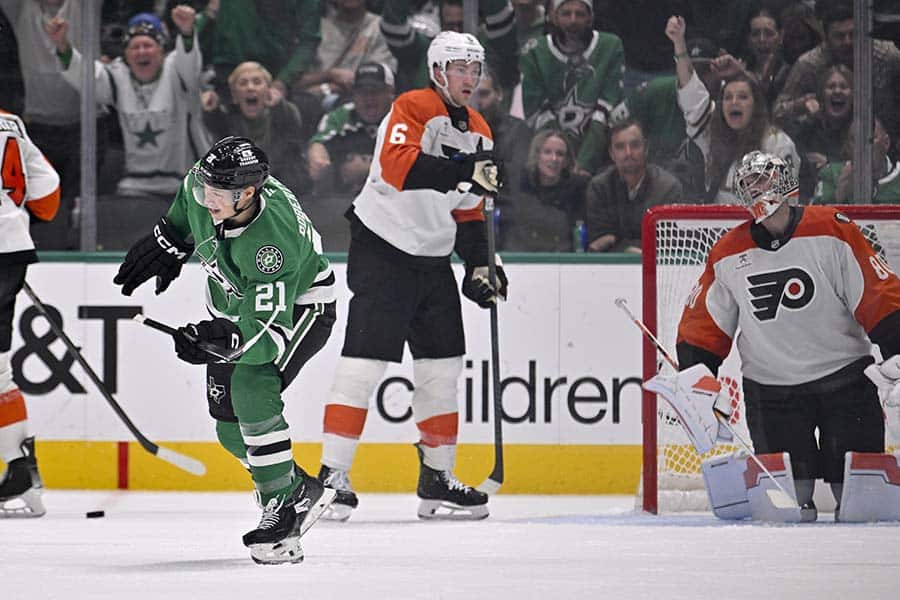 Nov 15, 2025; Dallas, Texas, USA; Dallas Stars left wing Jason Robertson (21) celebrates after he scores his third goal of the game against Philadelphia Flyers goaltender Dan Vladar (80) during the third period at the American Airlines Center.