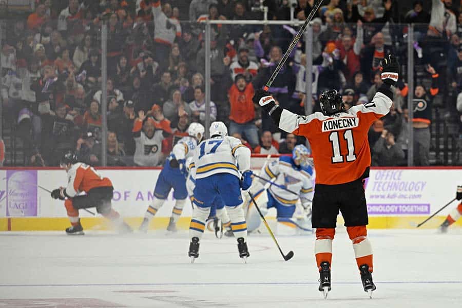 Nov 20, 2025; Philadelphia, Pennsylvania, USA; Philadelphia Flyers right wing Travis Konecny (11) celebrates game-winning goal in overtime by Philadelphia Flyers defenseman Travis Sanheim (6) against the St. Louis Blues at Xfinity Mobile Arena.