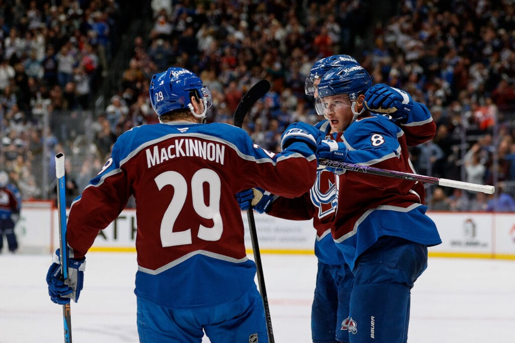 Colorado Avalanche defenseman Cale Makar (8) celebrates his goal with center Martin Necas (88) and center Nathan MacKinnon (29) in the second period against the New York Rangers at Ball Arena. Mandatory Credit: Isaiah J. Downing-Imagn Images