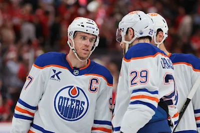 Edmonton Oilers captain Connor McDavid speaks to teammates during 2025 game. Edmonton Oilers captain Connor McDavid speaks to teammates during 2025 game.