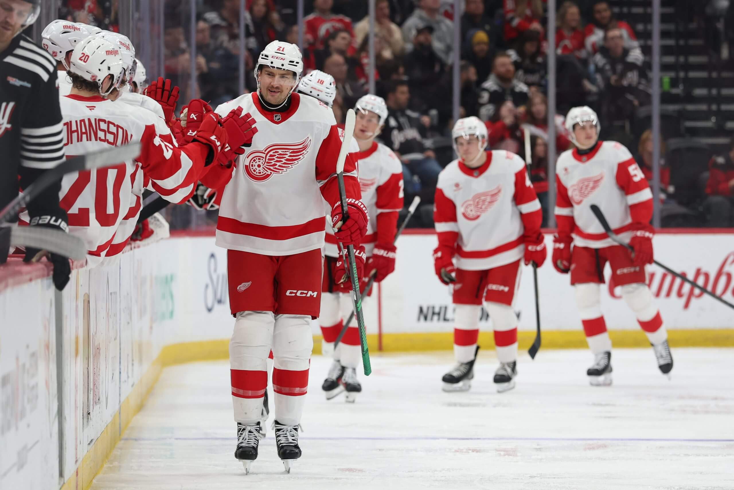 James van Riemsdyk makes his way down the fist-bump line after scoring a power-play goal.
