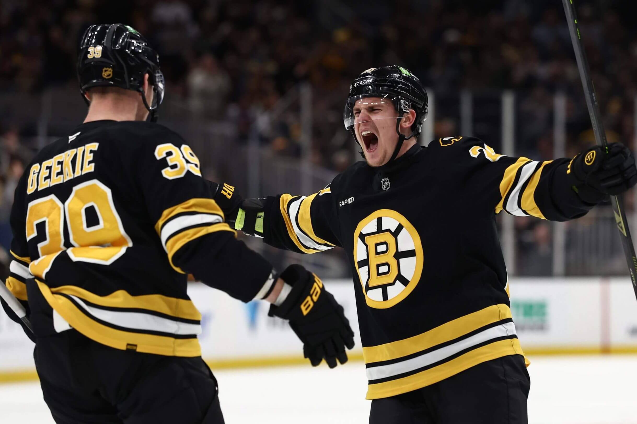 Morgan Geekie, left, and Boston Bruins teammate Henri Jokiharju celebrate after Geekie's goal in the third period.