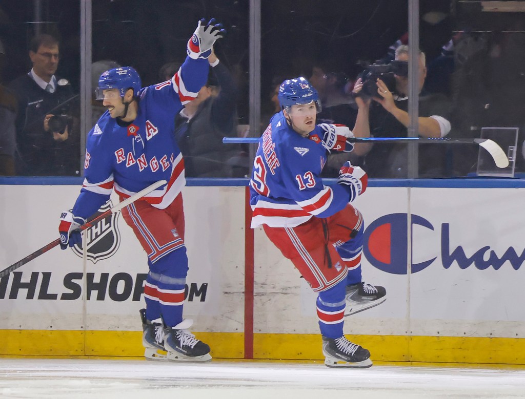 Vincent Trocheck (left) celebrates after a goal by Alexis Lafrenière (right) during the Rangers' win over the Penguins on Nov. 10, 2025.