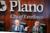 Plano Mayor John B. Muns (left) and city manager Mark Israelson participate in a city...