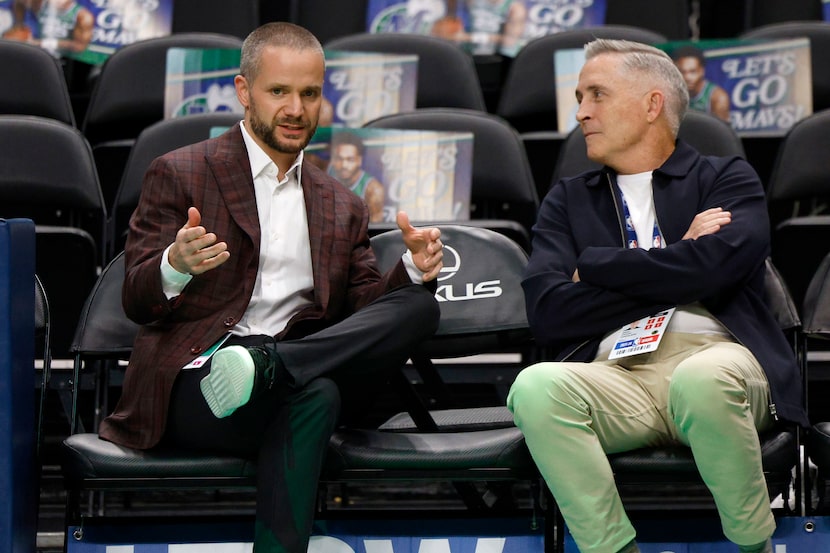 Matt Riccardi, Dallas Mavericks co-interim general manager, left, speaks to Phoenix Suns...