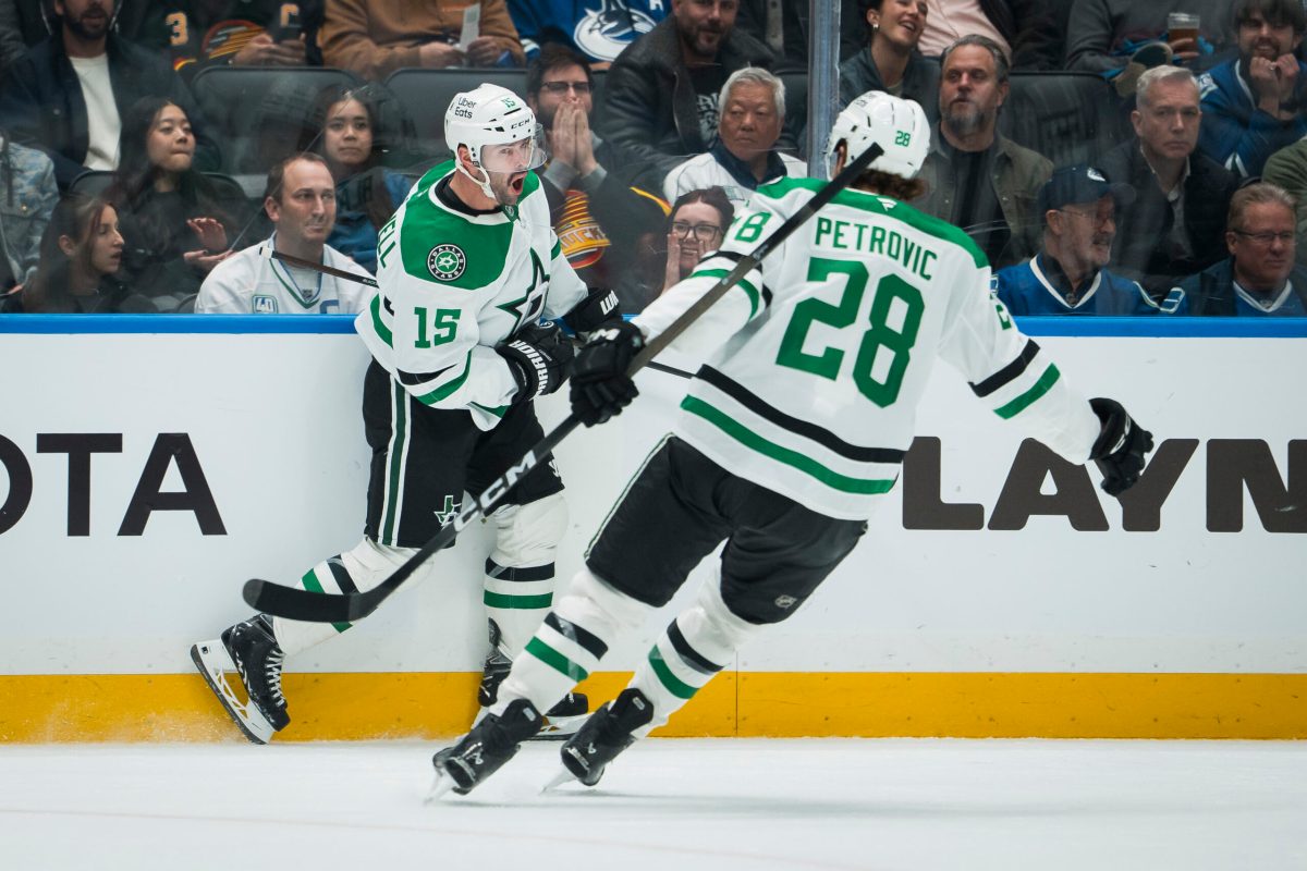 Nov 20, 2025; Vancouver, British Columbia, CAN; Dallas Stars forward Colin Blackwell (15) and defenseman Alexander Petrovic (28) celebrate BlackwellÕs goal against the Vancouver Canucks in the third period at Rogers Arena. Mandatory Credit: Bob Frid-Imagn Images