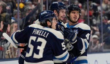 From left, to right Columbus Blue Jackets centers Luca Pinelli, Sean Monahan and Cole Sillinger celebrate after Monahan's goal during the first period of an NHL hockey game against the Pittsburgh Penguins, Friday, Nov. 28, 2025, in Columbus, Ohio.