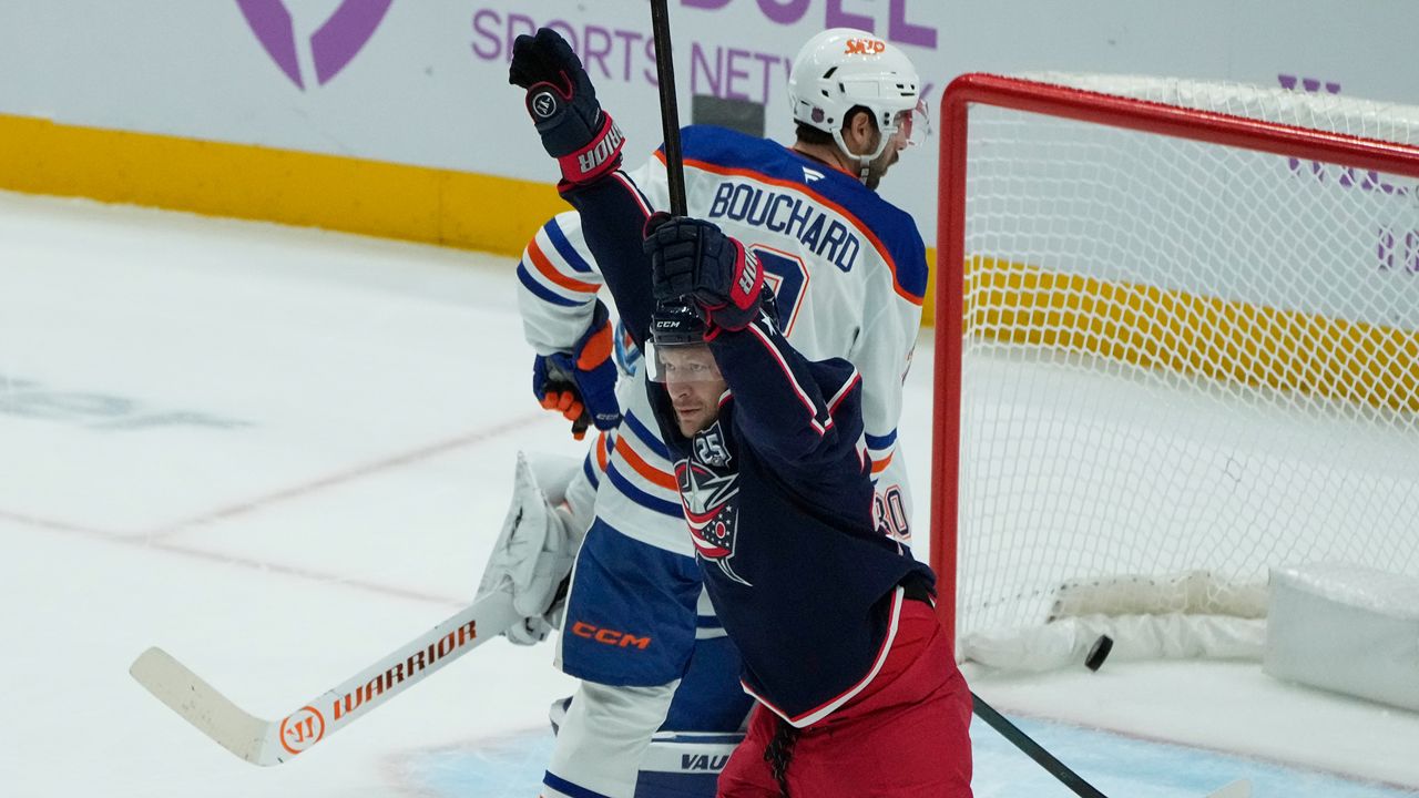 Columbus Blue Jackets right wing Mathieu Olivier (24) celebrates his goal in front of Edmonton Oilers center Curtis Lazar (20) in the first period of an NHL hockey game in Columbus, Thursday, Nov. 13, 2025. (AP Photo/Sue Ogrocki)