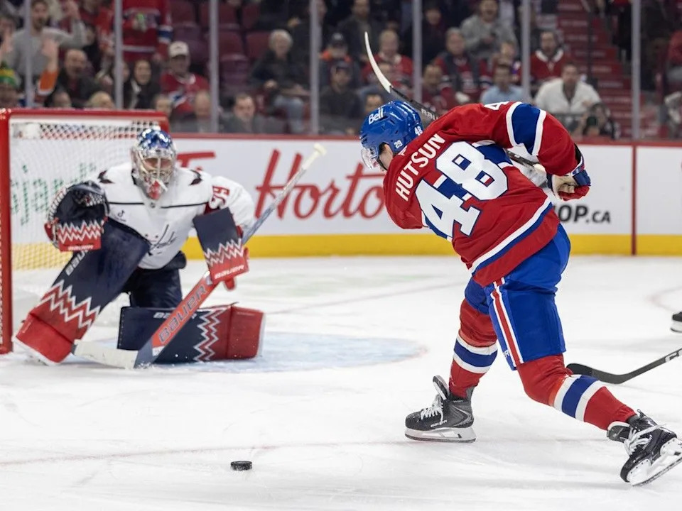  Canadiens’ Lane Hutson fans on a shot at Washington Capitals’ Charlie Lindgren in Montreal on Thursday, Nov. 20, 2025.