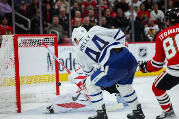 Toronto Maple Leafs defenseman Morgan Rielly (44) scores a goal past Chicago Blackhawks goaltender Spencer Knight (30) during the second period at the United Center Saturday Nov. 15, 2025 in Chicago. (Armando L. Sanchez/Chicago Tribune)