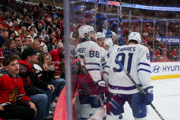 Toronto Maple Leafs players celebrate after Toronto Maple Leafs defenseman Morgan Rielly (44) scored a goal during the second period against the Chicago Blackhawks at the United Center Saturday Nov. 15, 2025 in Chicago. (Armando L. Sanchez/Chicago Tribune)