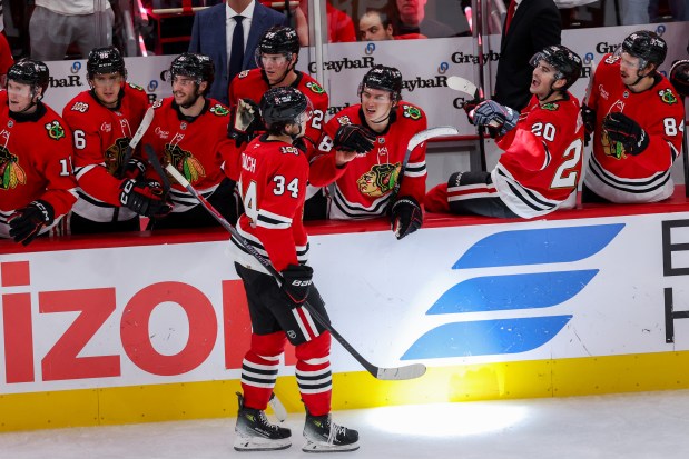 Chicago Blackhawks center Colton Dach (34) celebrates wit his team after scoring a goal during the third period against the Toronto Maple Leafs at the United Center Saturday Nov. 15, 2025 in Chicago. (Armando L. Sanchez/Chicago Tribune)
