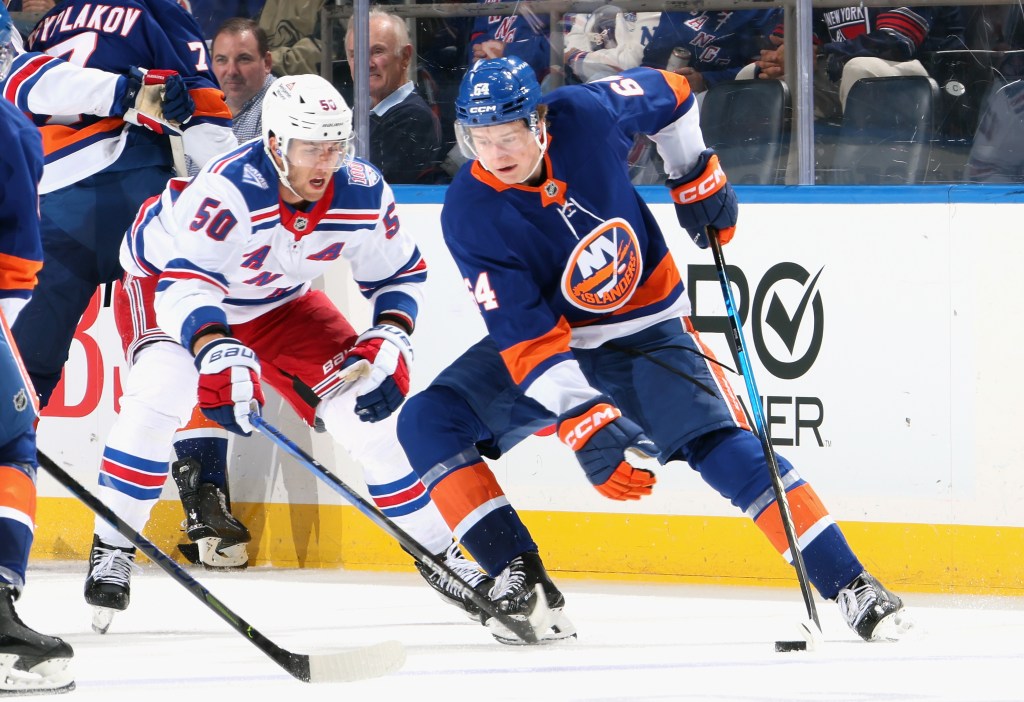 Will Cuylle #50 of the New York Rangers checks Calum Ritchie #64 of the New York Islanders during the third period at UBS Arena on September 29, 2025 in Elmont City. 
