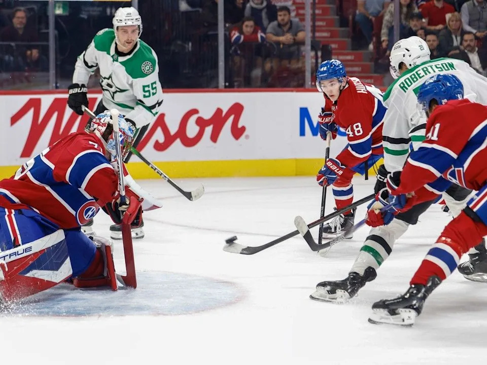 Dallas Stars’ Thomas Harley, left, looks on as Jason Robertson scores past Canadiens’ Jakub Dobes while being defended by Oliver Kapanen and Lane Hutson, 48, Thursday in Montreal.