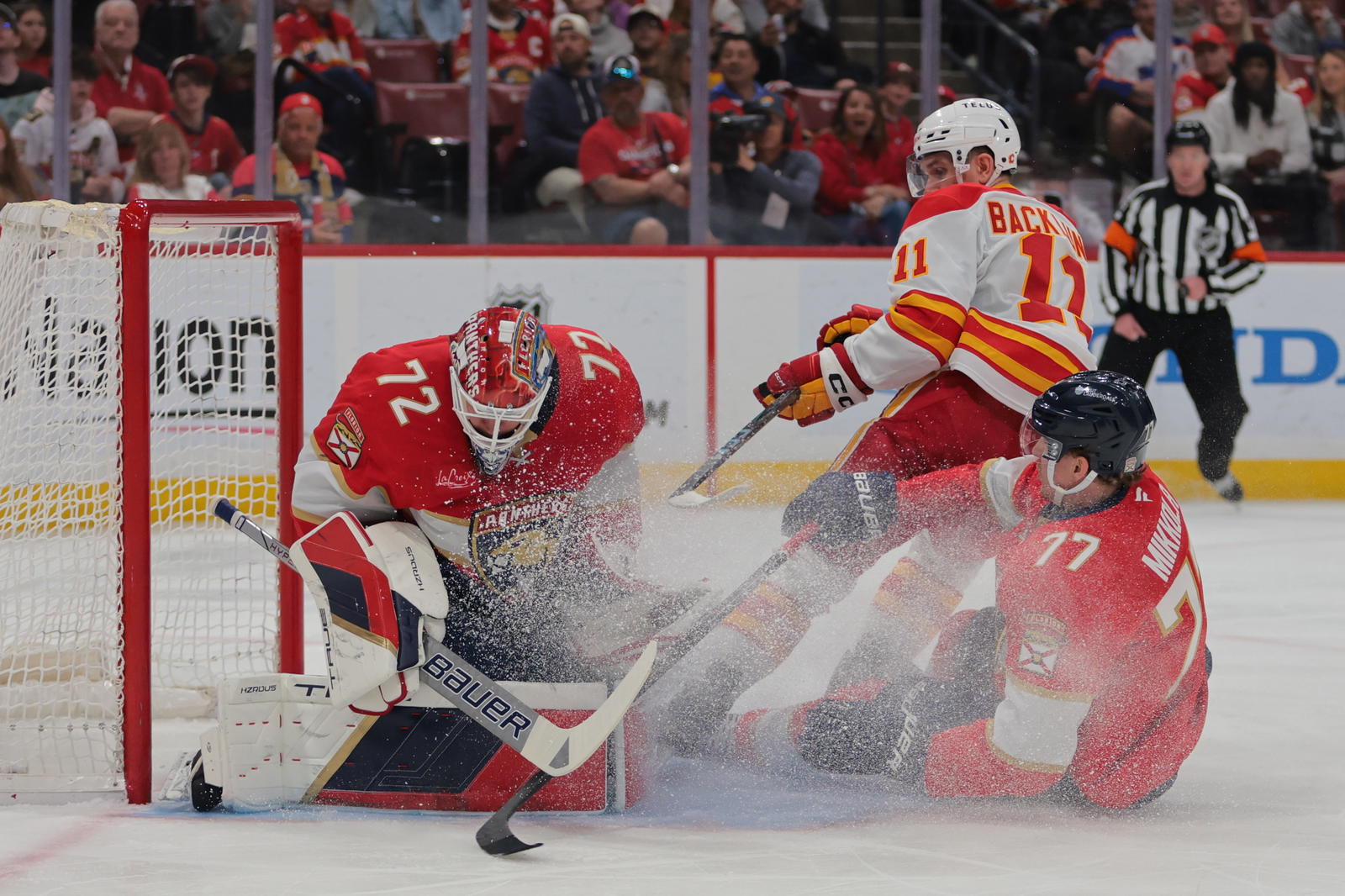Florida Panthers goaltender Sergei Bobrovsky (72) makes a save against Calgary Flames centre Mikael Backlund (11) during their game at the Amerant Bank Arena in Sunrise, Florida (Source: Sam Navarro-Imagn Images)