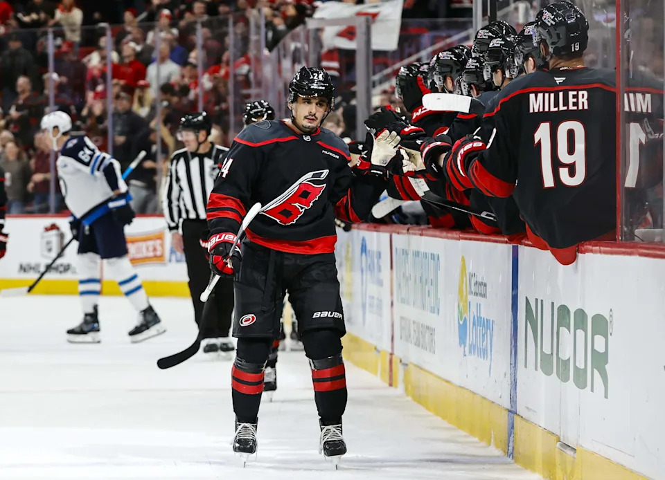 Carolina Hurricanes forward Seth Jarvis celebrates a goal with the bench during the first period against the Winnipeg Jets at Lenovo Center on Nov. 28, 2025 in Raleigh, North Carolina.