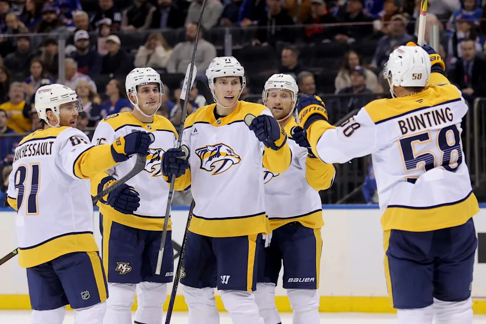 Nov 10, 2025; New York, New York, USA; Nashville Predators right wing Matthew Wood (71) celebrates his goal against the New York Rangers with center Jonathan Marchessault (81) and defenseman Brady Skjei (76) and center Steven Stamkos (91) and left wing Michael Bunting (58) during the first period at Madison Square Garden. Mandatory Credit: Brad Penner-Imagn Images