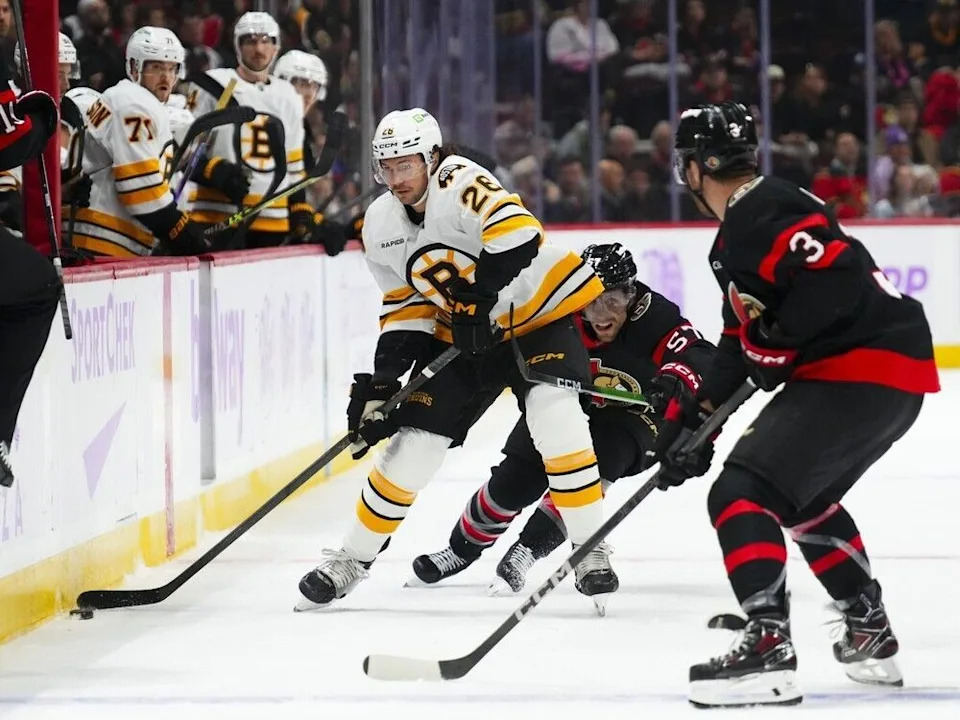  Ottawa Senators defenceman Nick Jensen, right, in action against the Boston Bruins in the first period of a game on Thursday night. Jensen left the game after the second period following a hard hit from Boston centre Mark Kastelic.