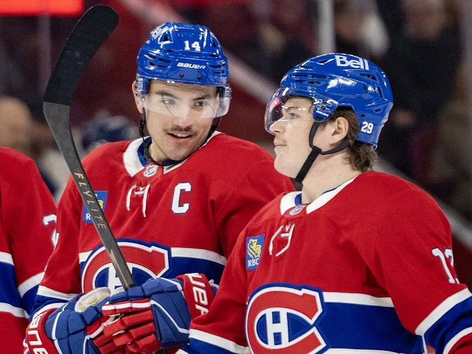  Canadiens captain Nick Suzuki, left, and Cole Caufield confer during first period against the Washington Capitals in Montreal on Thursday night.