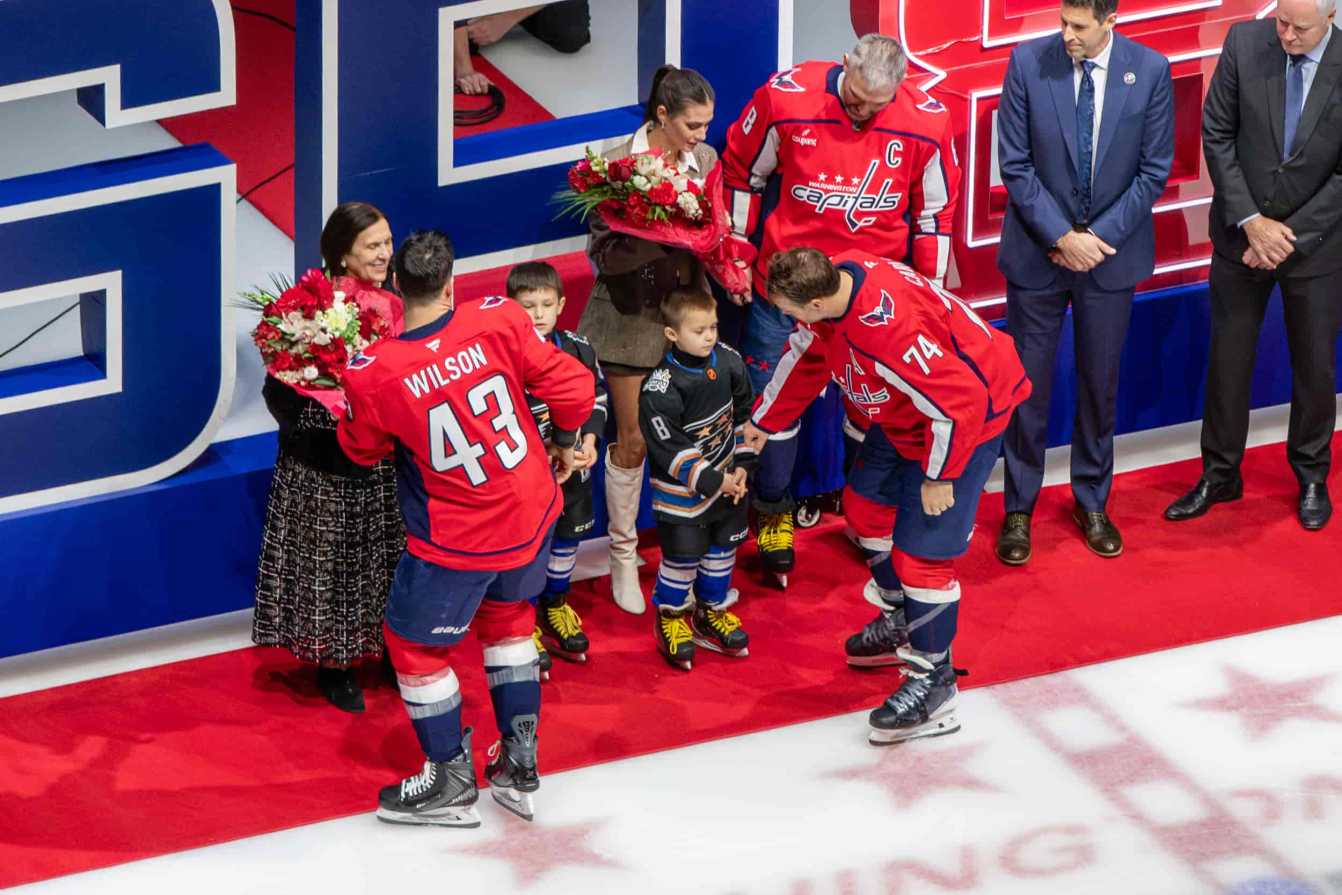 John Carlson and Tom Wilson greet the Ovechkin family