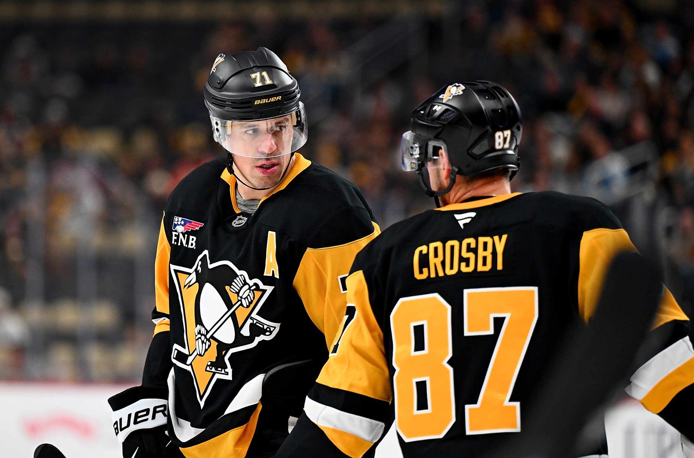 Hall of Famers doing Hall of Famer things. (Photo by Joe Sargent/NHLI via Getty Images)