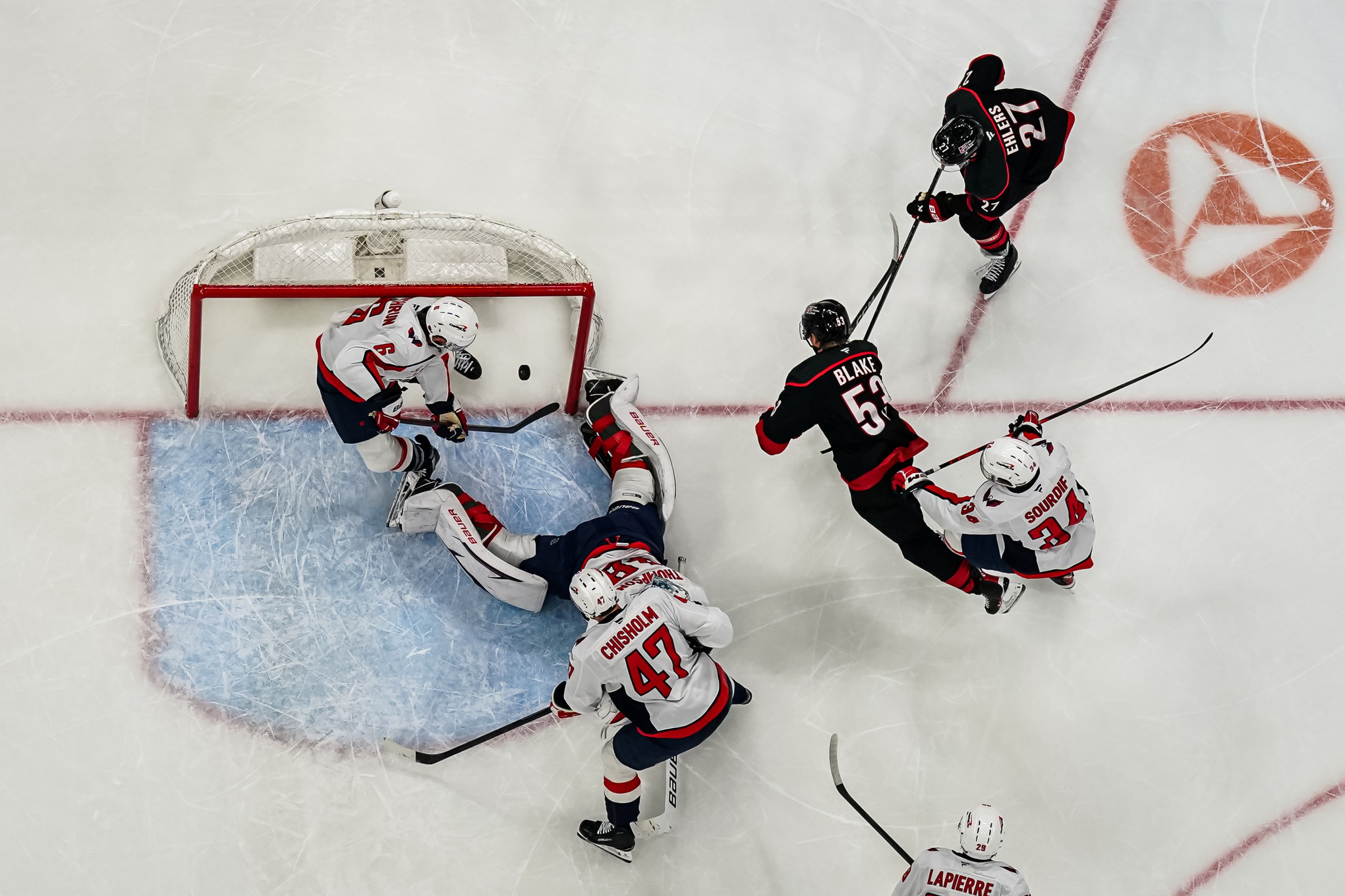 RALEIGH, NORTH CAROLINA - NOVEMBER 11: Nikolaj Ehlers #27 of the Carolina Hurricanes scores a goal against Logan Thompson #48 of the Washington Capitals during the second period at Lenovo Center on November 11, 2025 in Raleigh, North Carolina. (Photo by Josh Lavallee/NHLI via Getty Images)