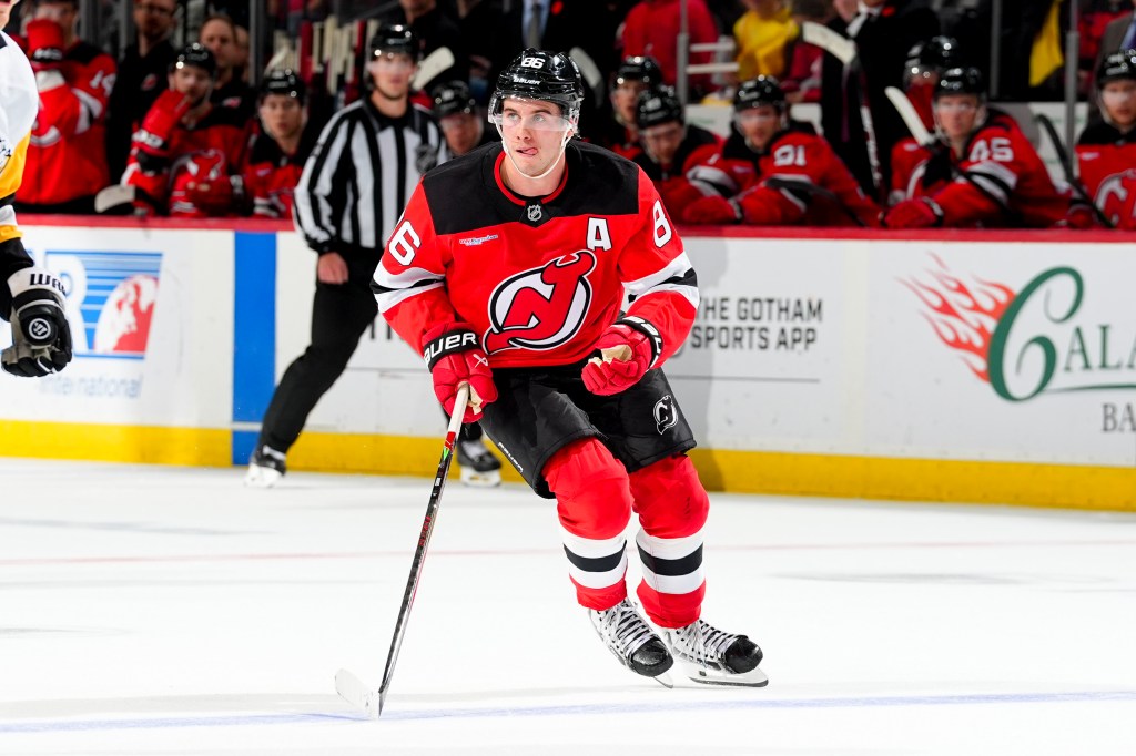 Jack Hughes of the New Jersey Devils skates during an ice hockey game.