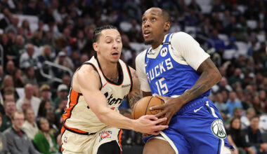 Jamaree Bouyea #15 of the Milwaukee Bucks drives to the basket against Lindy Waters III #43 of the ...