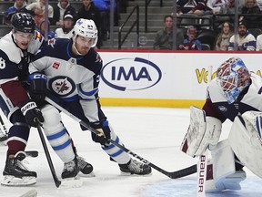 Winnipeg Jets defenxeman Dylan Samberg looks for the puck