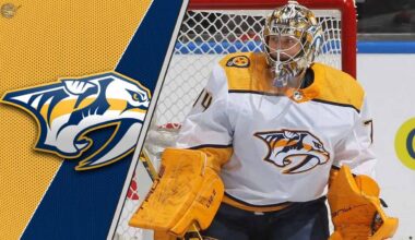 Nashville Predators goalie Juuse Saros looks on intently during a game, his future with the struggling team in question amid NHL trade rumors.