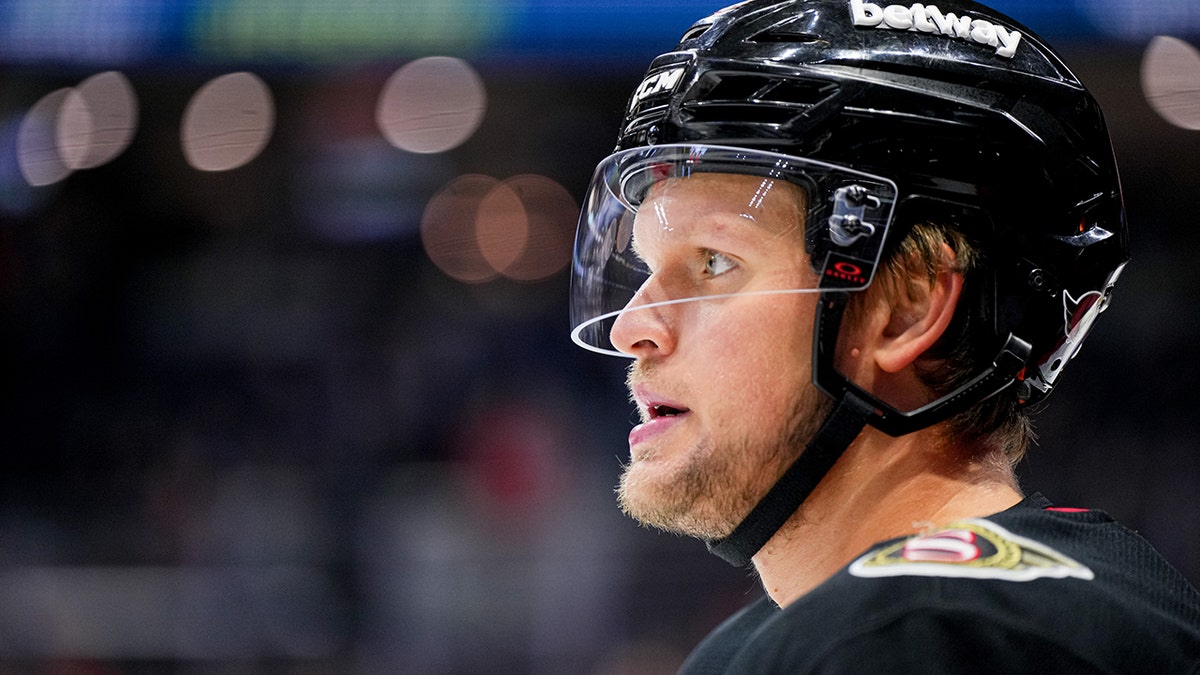 arthur kaliyev with hockey helmet on during game
